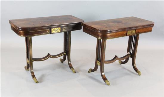 A pair of Regency brass inset rosewood card tables, W.2ft 11in. D.1ft 5.5in. H.2ft 5in.